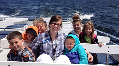 teacher and students on a ship