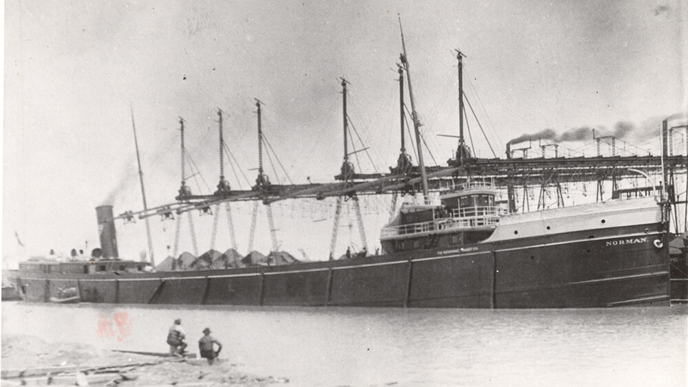 A black and white photo of a ship