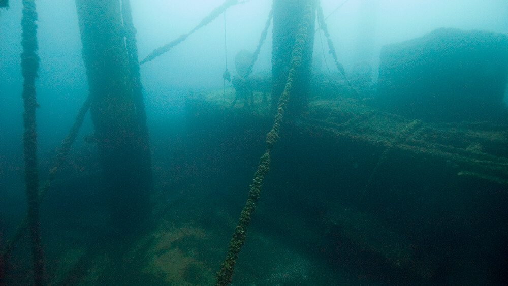 A deck of a shipwreck in merky water