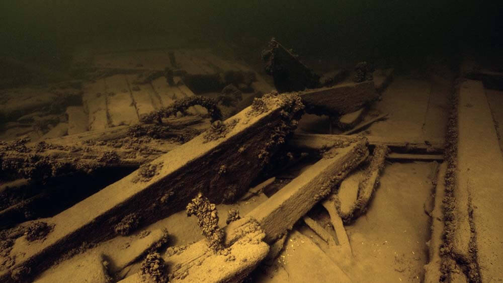 Debris from a shipwreck in merky water